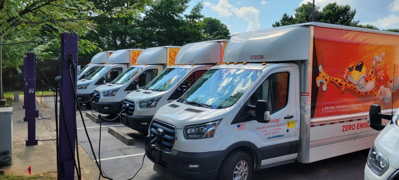 Frito-Lay electric delivery trucks connected to Level 2 chargers at a Decatur Georgia depot