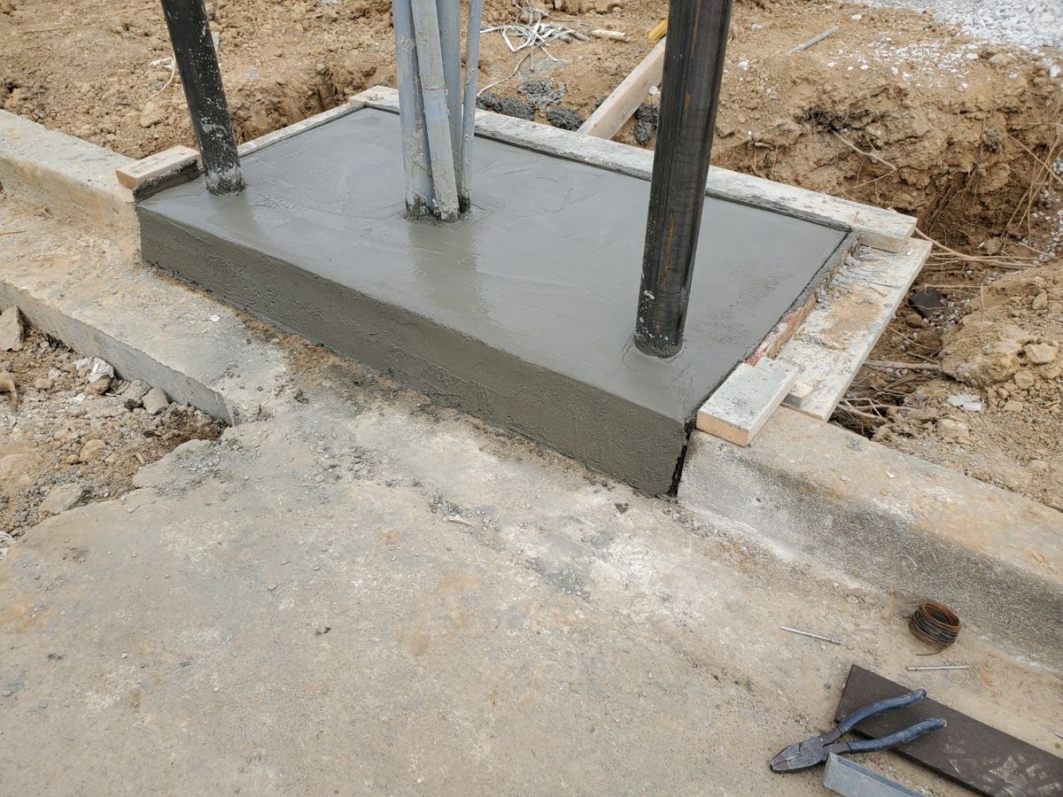 Fresh concrete equipment pad with conduit